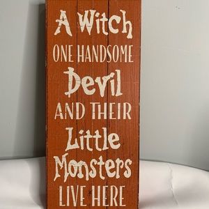 A Witch ONE HANDSOME Devil AND THEIR Little Monsters LIVE HERE